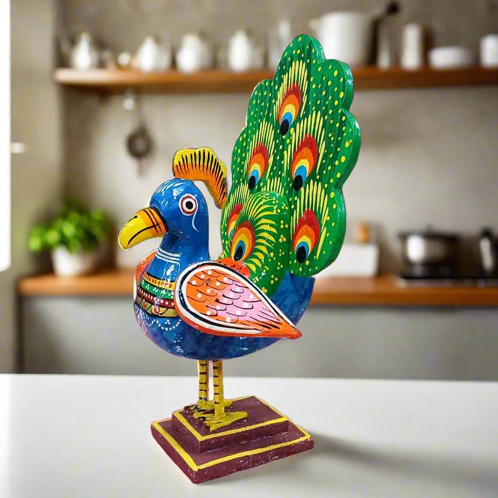 KK Gift Store Bird Statues collection featuring Wooden Dancing Peacock, Owl, Parrot, Meenakari Peacock, and Metal Peacock figurines.
