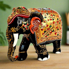 A 13cm wooden elephant statue with a fine black finish, perfect for a showpiece.