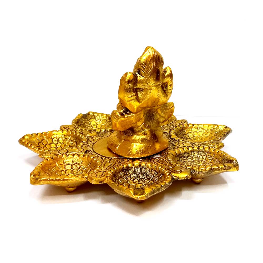 A 15cm compact metal Ganesha figurine, a perfect addition to a shelf or mantle.