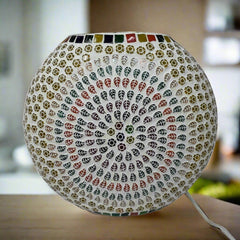 An amazing oval glass lamp with a beautiful mosaic design that attracts everyone's attention.