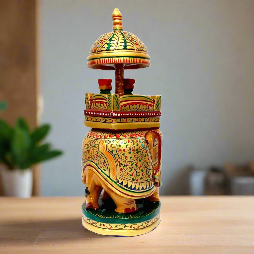 A unique Ambabadi elephant statue depicting a king and queen riding with a mahout.