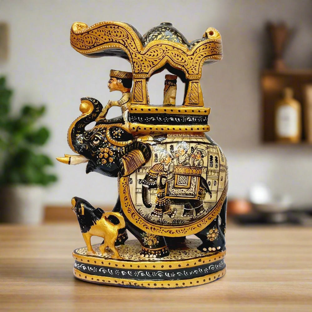 An Ambari elephant statue featuring elaborate miniature hand painting and a king riding.