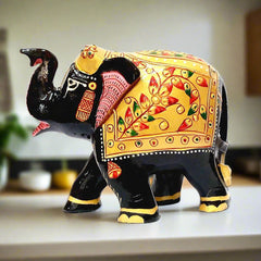 Artistic Kadamba wood elephant statue with intricate painting on eyes, teeth, nails and neck.