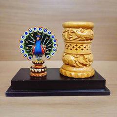Decorative wooden pen stand with vibrant peacock sculpture, artistic desk accessory