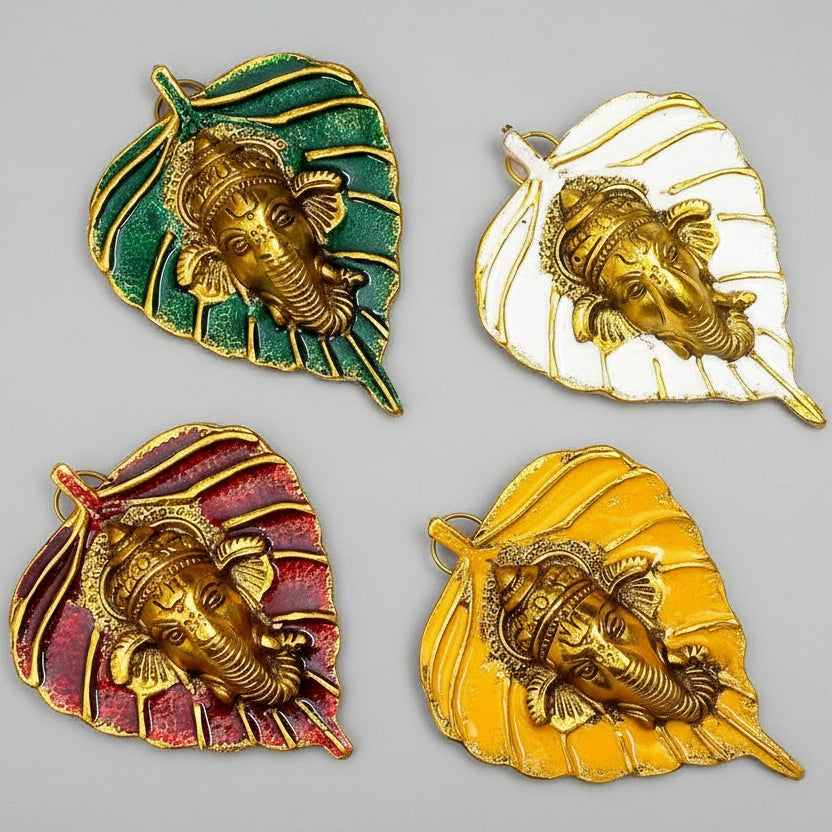 Group of leaf Ganesha idols in assorted red, yellow, white, and green colors for wall decoration.