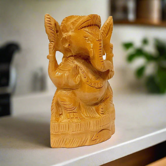 Auspicious wooden Ganeshji statue perfect for keeping in home temple.