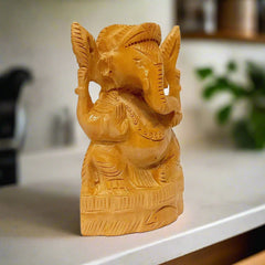 Auspicious wooden Ganeshji statue perfect for keeping in home temple.