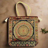 A Banarasi silk tote bag with vibrant colors and amazing zari work.