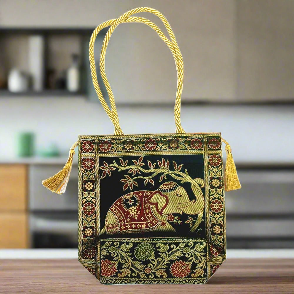 Banarasi silk tote with golden tassels on both sides, perfect for shopping travel.