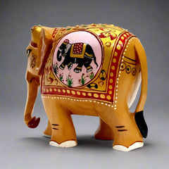 A beautiful elephant showpiece made of fine, dried wood, perfect for gifting.