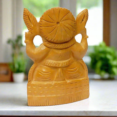 Beautifully carved wooden Lord Ganesha idol crafted for devotion.