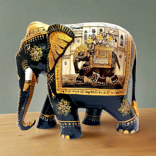 A black elephant figurine with intricate miniature painting, perfect for home decor.