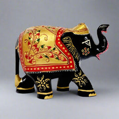 Black painted wooden elephant figurine with detailed craftsmanship.