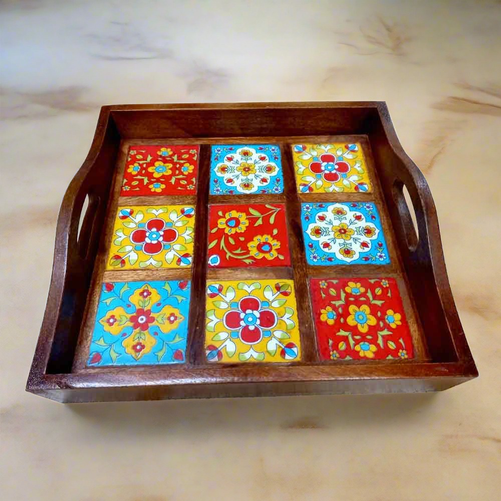 Decorative wooden tray with multicolored blue pottery tile accents.