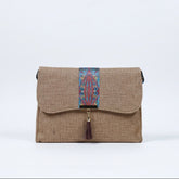 Front view of a 10x8 inch boho crossbody bag with leather tassel and floral strap