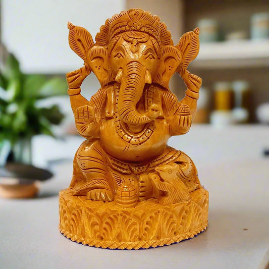 Carved wooden Ganesha statue, completely handmade from a single piece of wood.