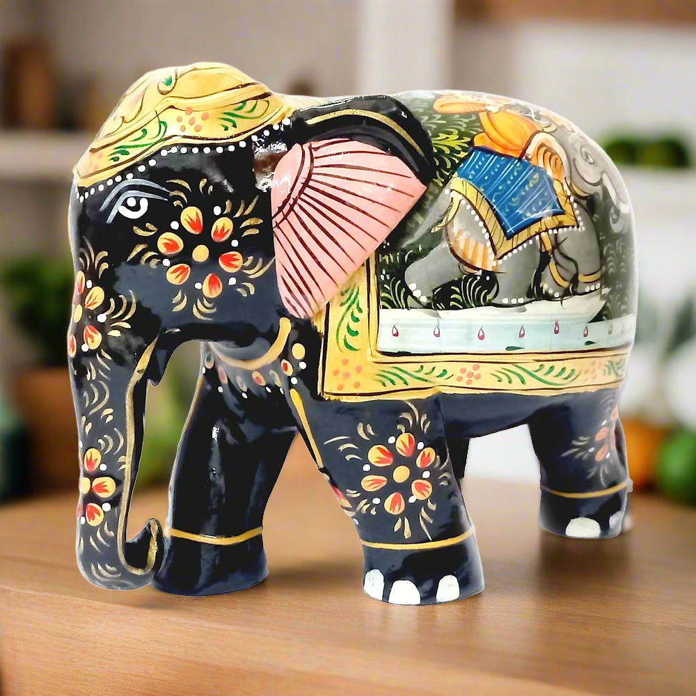 Classic wooden elephant carved from Kadamba wood, featuring black paint and handcrafted Mughal paintings