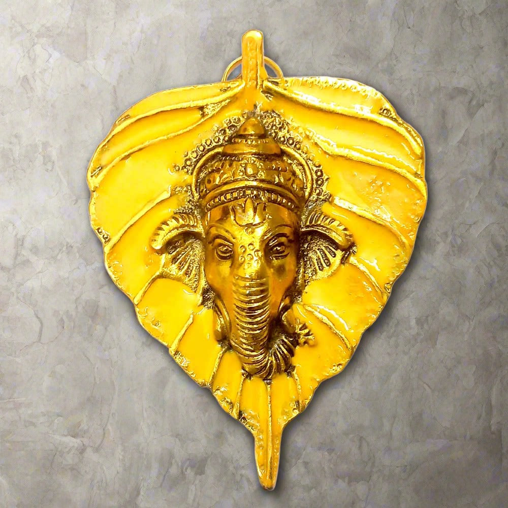 Colorful metal leaf Ganesha idol with enamel painting for wall decoration.