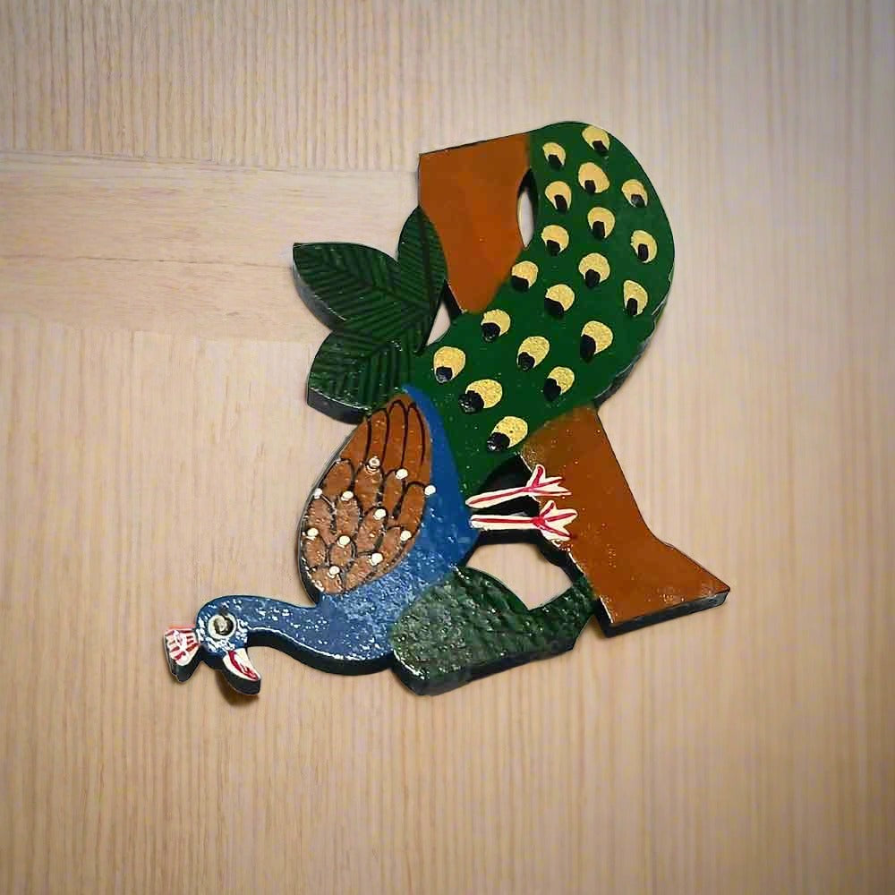 Decorative wooden fridge magnet featuring a colorful peacock design