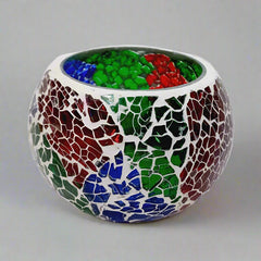 Compact crackle design glass candle holder with candle, providing beautiful illumination for small spaces.