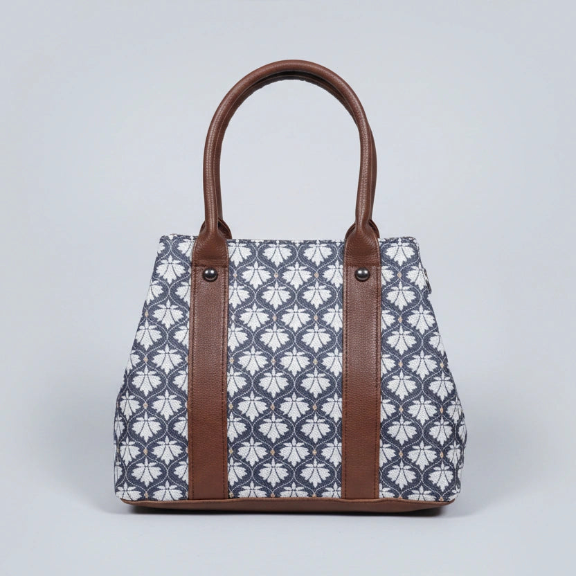 Close-up detail of the premium quality cotton fabric showing the vibrant floral print and high-stitch ethnic pattern.