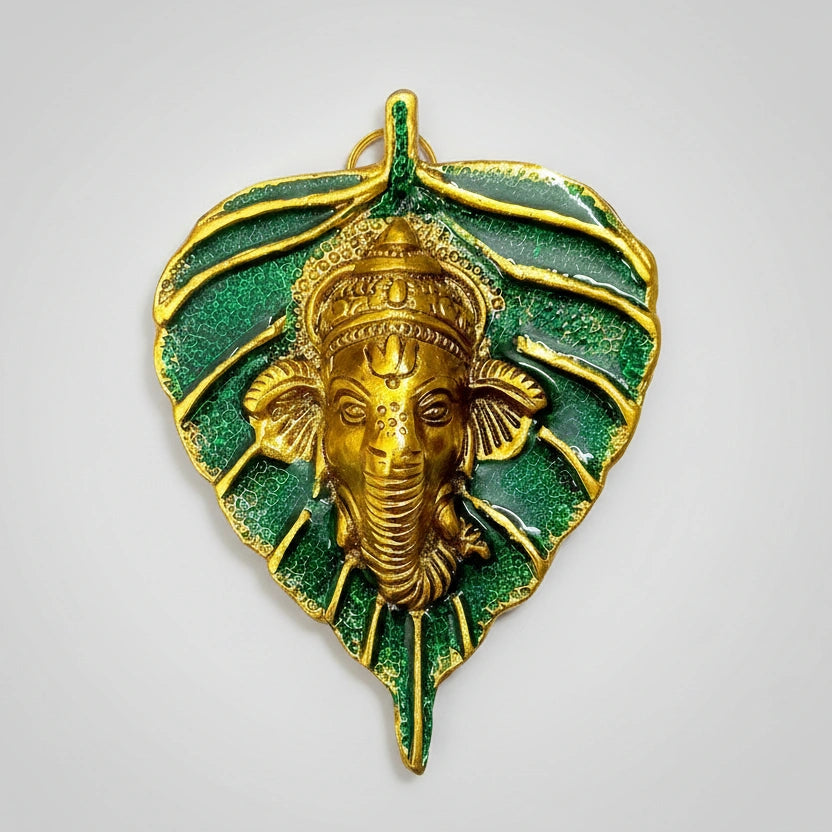 Metal leaf Ganesh showpiece with custom printing option for bride and groom names or company logos.