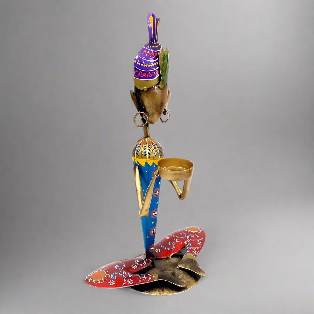 Decorative tea light holder with fine detailing, perfect for mantelpiece or coffee table decor.