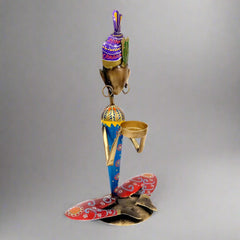 Decorative tea light holder with fine detailing, perfect for mantelpiece or coffee table decor.