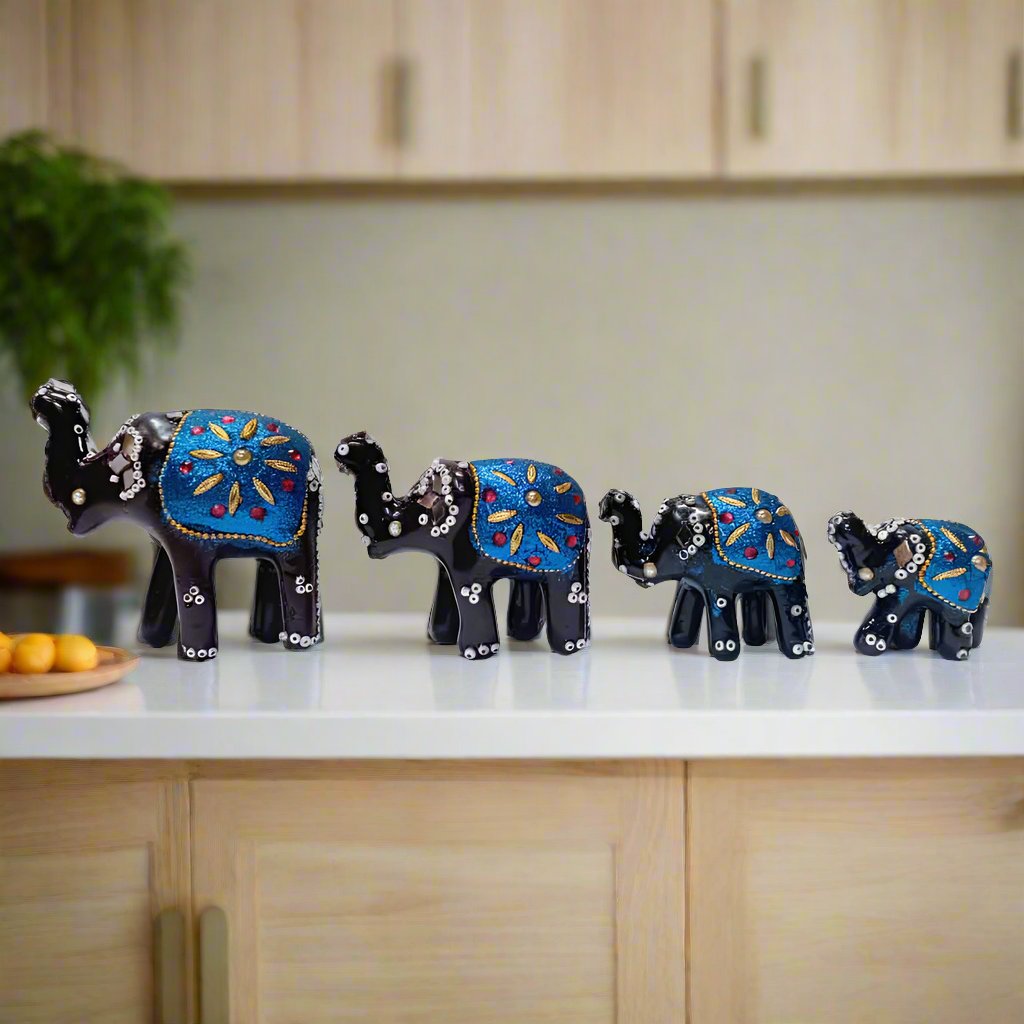 Set of 4 lacquered elephants with intricate detailing, perfect for home or office decor