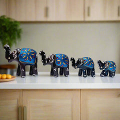 Set of 4 lacquered elephants with intricate detailing, perfect for home or office decor