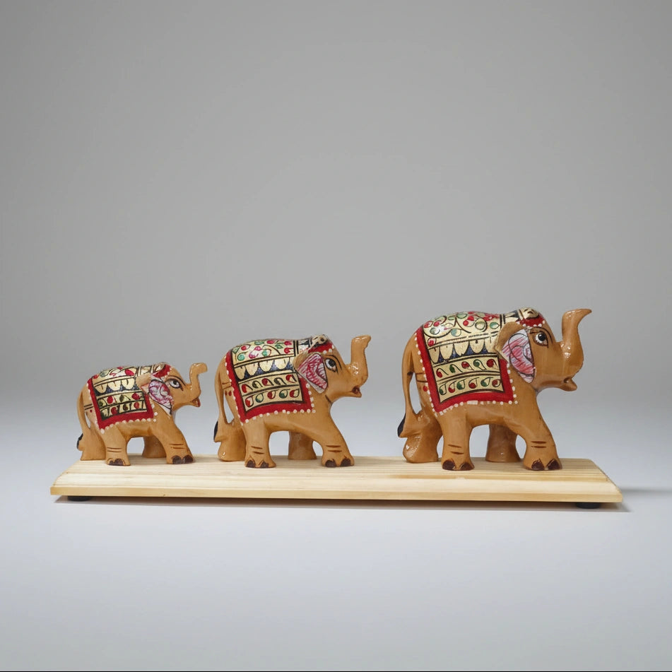 Close-up of the intricate hand-painted floral motifs on a polished wooden elephant bridge, showcasing the artisanal details and vibrant colors.