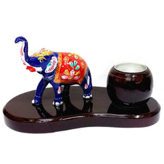 A decorative elephant t-light holder made from wood and metal, ideal for home and gifting.