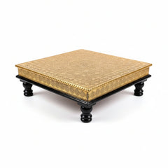 Decorative wooden chowki stool featuring intricate metal sheet art in a dark brown finish.