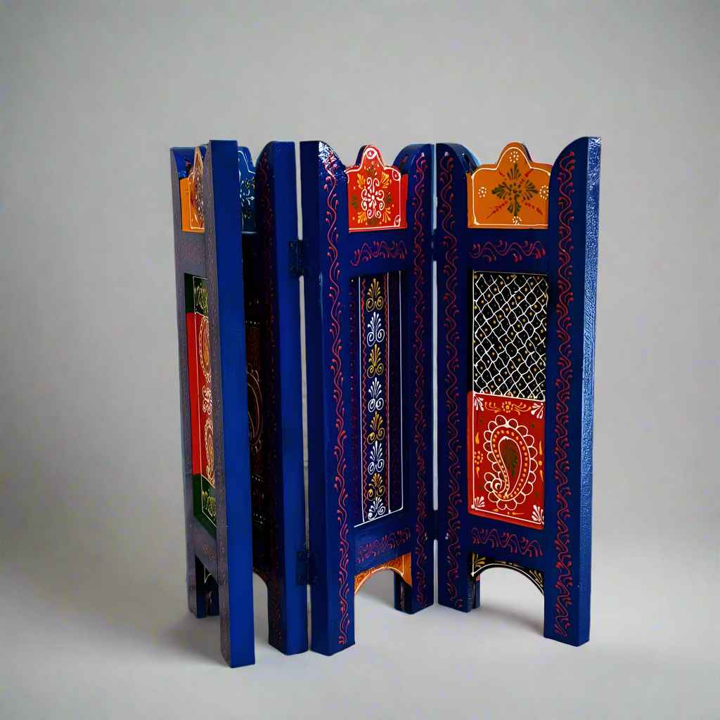 Compact wooden screen with artisan-crafted emboss and hand-painted finish, placed as a backdrop for event decoration.