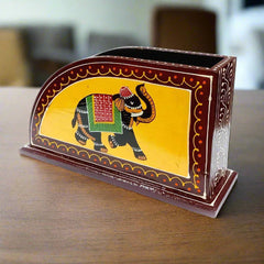 A decorative wooden napkin stand, perfect for home decor and tabletop use.