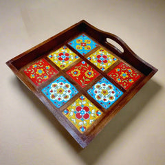 Elegant serving tray combining natural wood and blue pottery art.