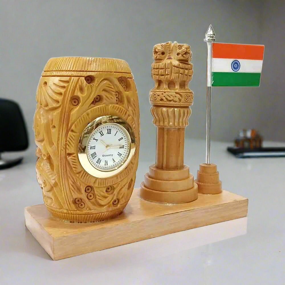 A decorative desk organizer with a clock and the Ashok Pillar, ideal for an office.