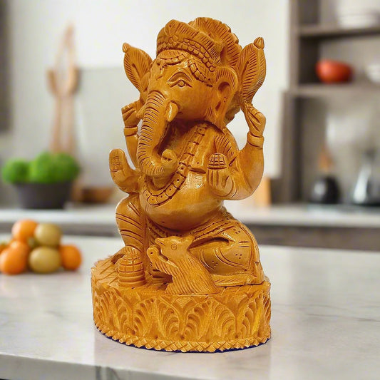 Detailed wooden Ganpati idol with magnificent carvings, ideal for worship.