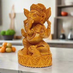 Detailed wooden Ganpati idol with magnificent carvings, ideal for worship.
