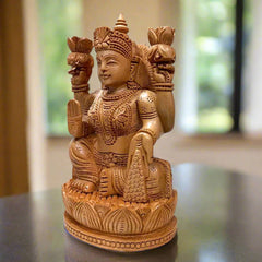 Traditional wooden Lakshmi idol, intricately carved with auspicious detailing