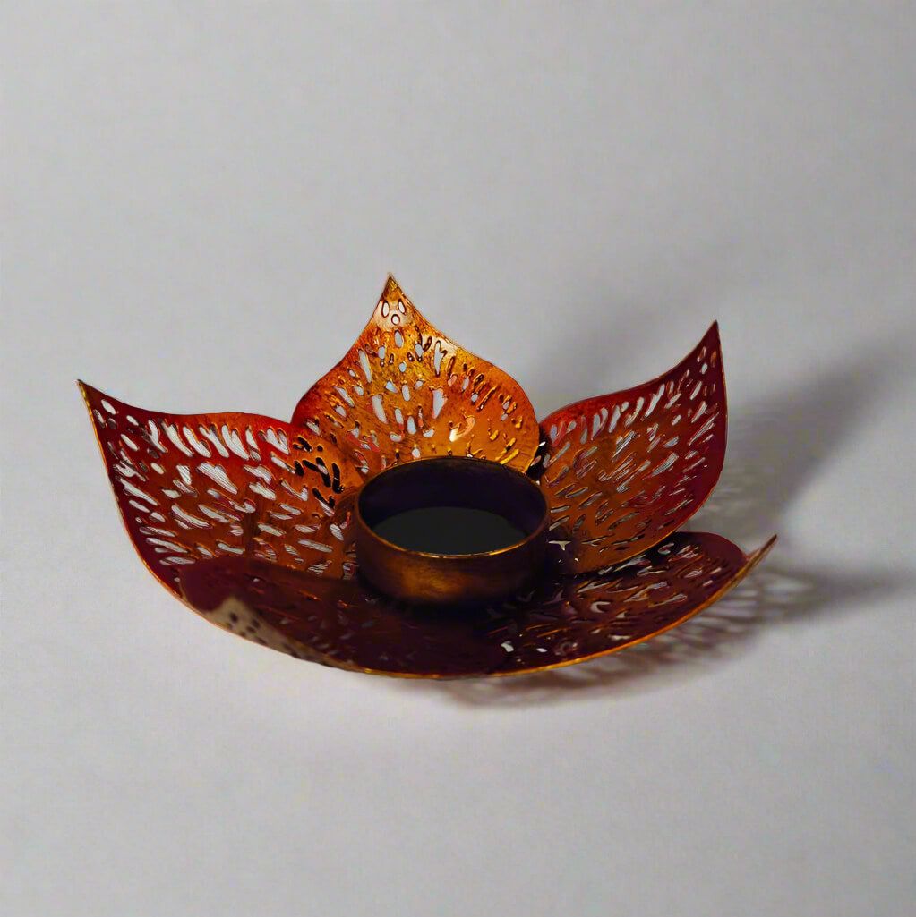Elegant round metal lotus candle holder with bloom leaf motif, perfect for gifting on weddings and anniversaries.
