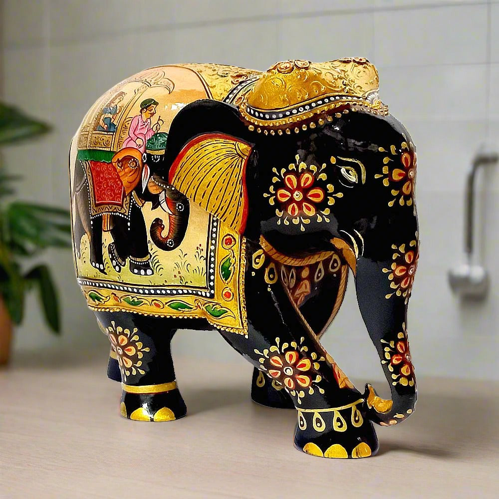 An exquisite, hand-painted elephant statue with intricate designs and elegant curves.