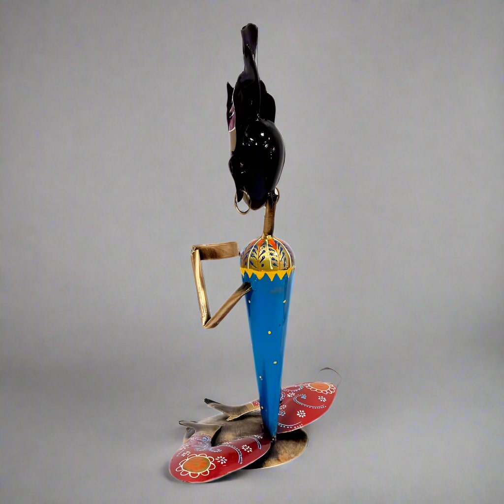 Intricately painted figurine candle stand adding sophistication and charm to living spaces.