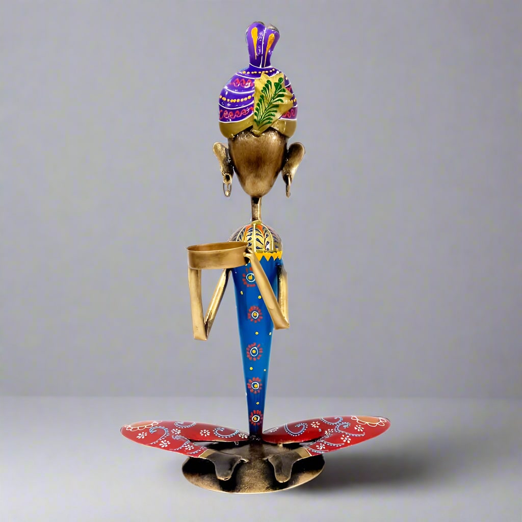 Handmade metal figurine tea light candle holder with intricate painting and durable finish.