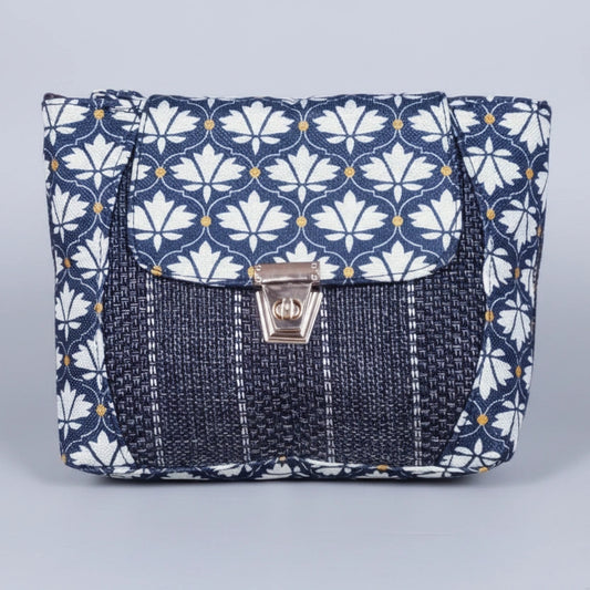 Front view of the 10x8 inch floral Jacquard sling bag with golden button closure