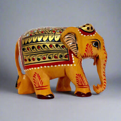 Floral painted wooden elephant with intricate hand painting on stomach, back, and forehead, suitable for gifting and decor