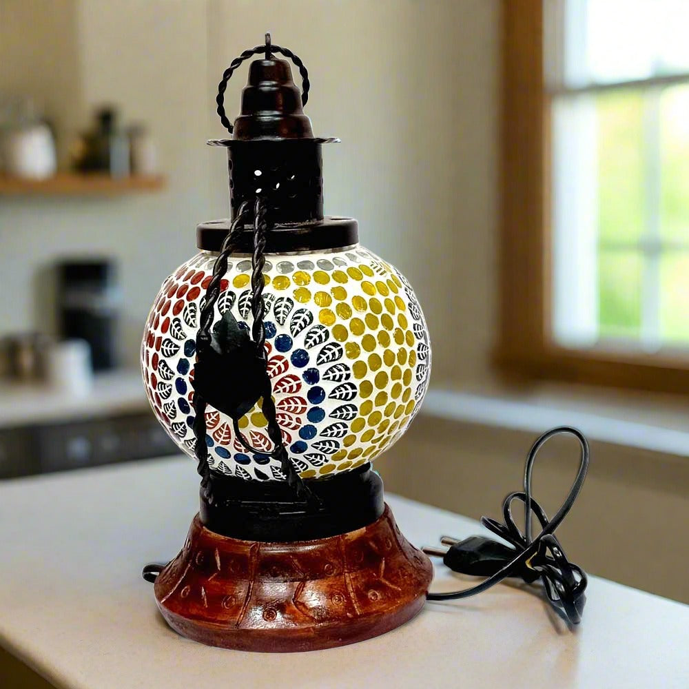 A colorful mosaic lamp made of glass and metal, perfect for adding vibrant home decor.
