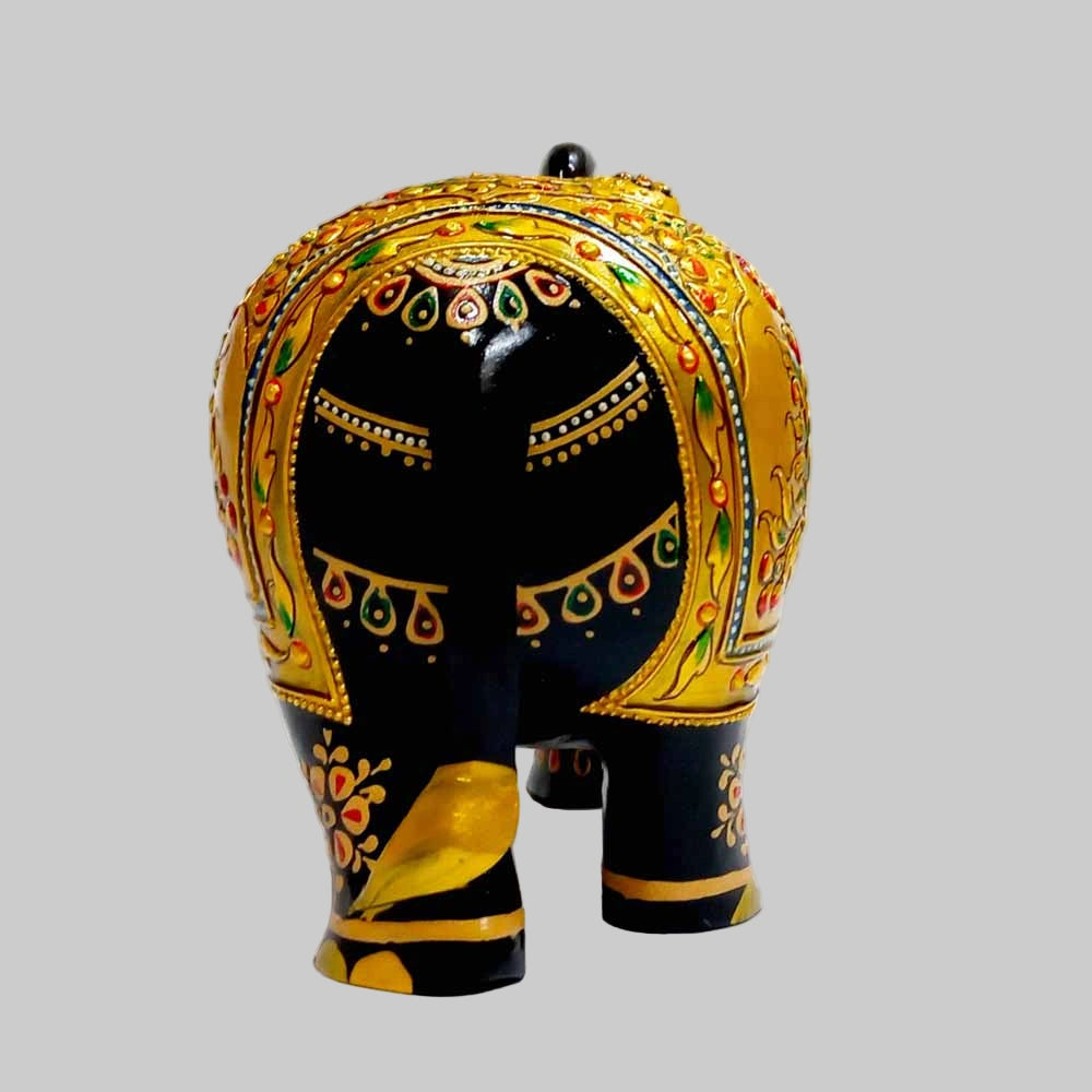 Close-up of gold trunk and head on premium wooden salute elephant showpiece