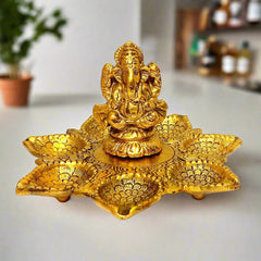 A golden metal Ganesha statue with seven diyas, perfect for puja or home decor.