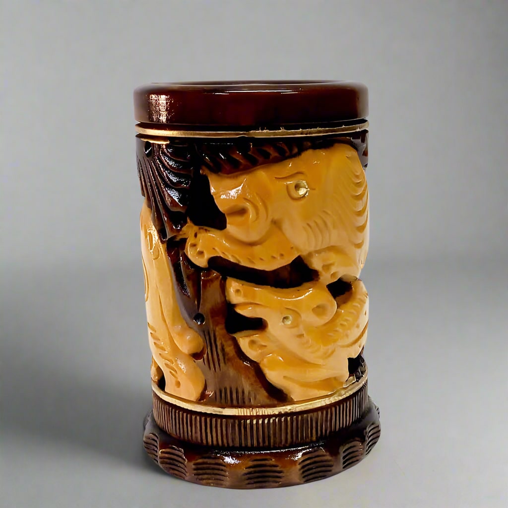 Hand-carved wood pen stand featuring a 2-tone design with natural wood grain and brown painted animal details.